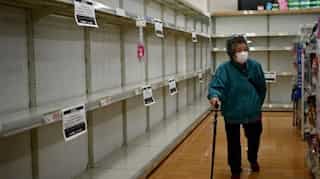Tokyo restricts movement to combat virus, some folk carry on as usual