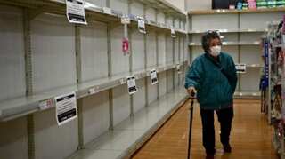 Tokyo restricts movement to combat virus, some folk carry on as usual