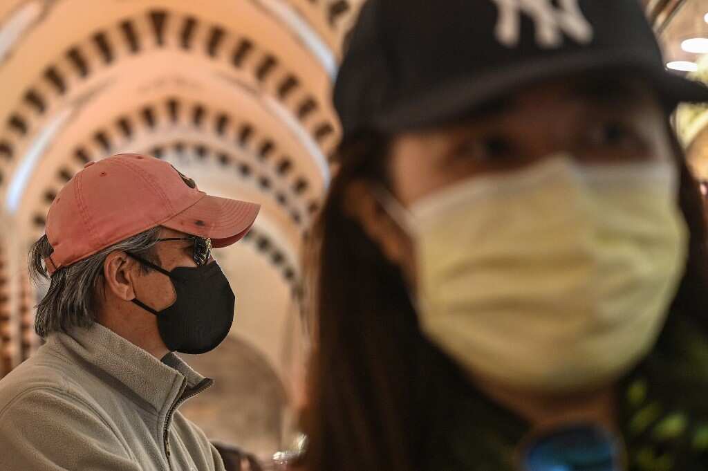 Hong Kong political rivals are wooing voters with free face masks