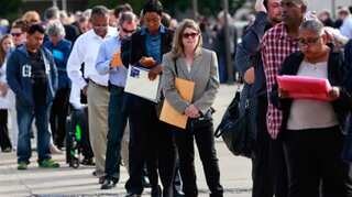 US jobless claims dip, easing concerns about labour market shift