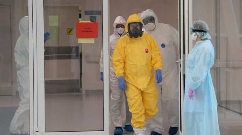 Putin dons hazmat suit as Moscow says coronavirus outbreak is worse than it looks