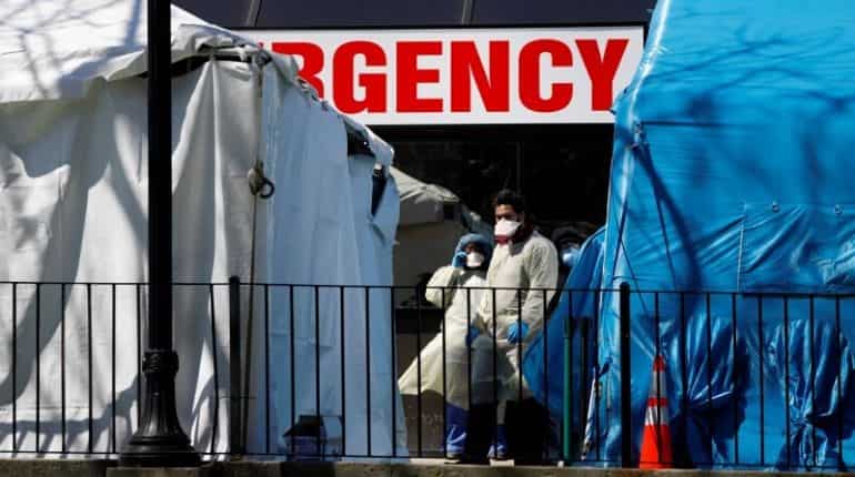 'We're trying to keep our heads above water': US healthcare workers fight shortages and fear 'We're trying to keep our heads above water': US healthcare workers fight shortages and fear