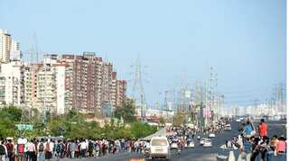 Coronavirus lockdown: Migrants walk on foot, board buses at UP's Ghaziabad