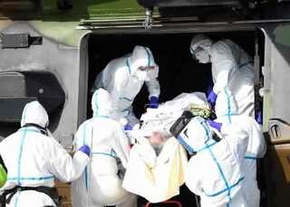 With record 833 new fatalities, France death toll nears 9,000