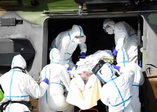 With record 833 new fatalities, France death toll nears 9,000