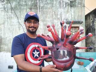 A novel coronavirus helmet that uses art to enforce discipline