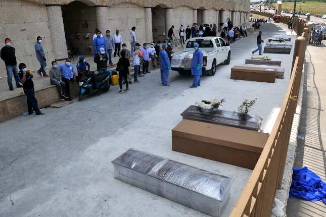 COVID-19: Shortage of coffins forces locals to resort to using cardboard boxes in Ecuador