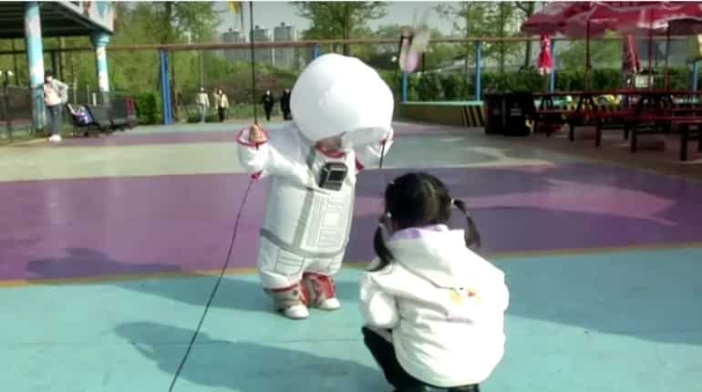 Chinese father designs space suit for two-year-old to shield him from coronavirus