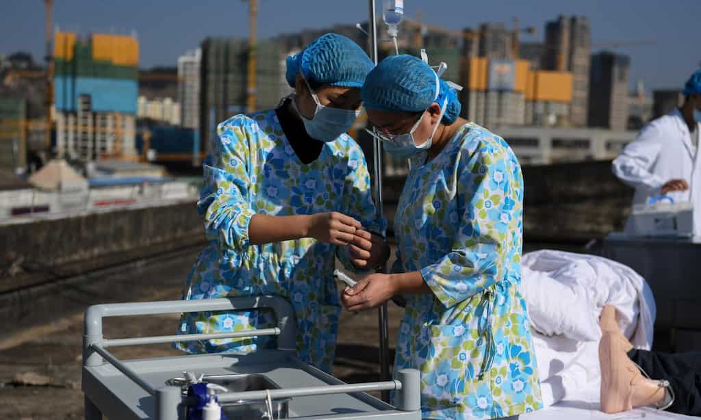 China under mounting pressure over virus origins