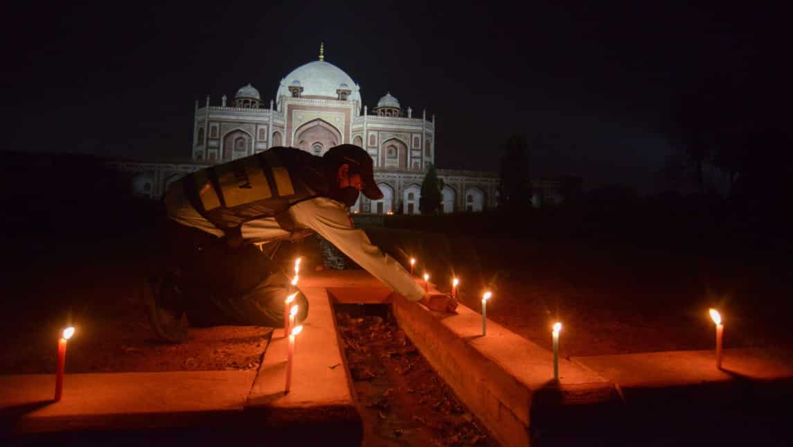 Lighting candles in darkness