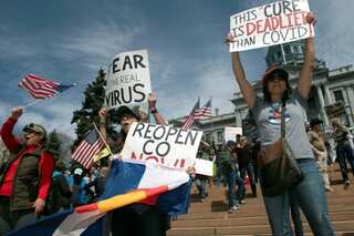 Protestors converge at Washington state capitol to rally against coronavirus curbs