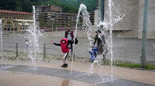 Fresh air at last! Spanish children go outdoors for first time in six weeks