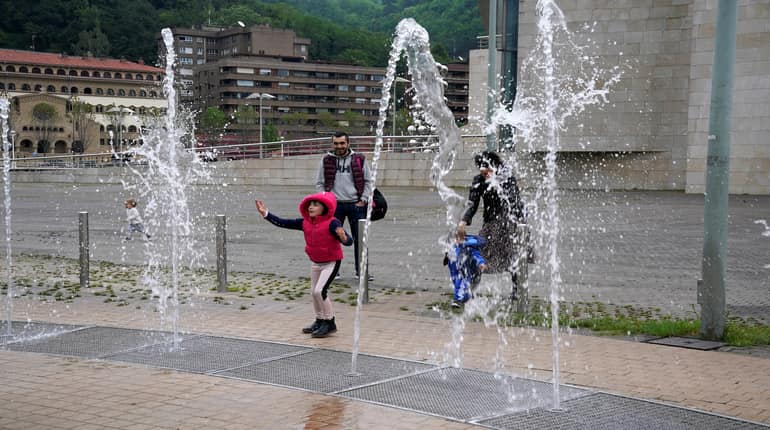 Fresh air at last! Spanish children go outdoors for first time in six weeks
