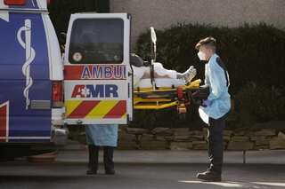 In coronavirus-hit Texas and Arizona, refrigerated trucks are being used to store dead
