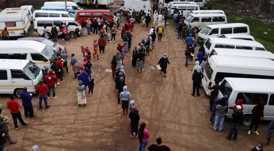 People stand in 4 km-long queue for food in South Africa amid coronavirus pandemic
