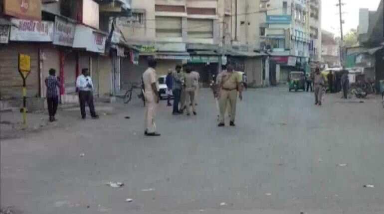 Locals clash with police during containment zone sealing in Gujarat Locals clash with police during containment zone sealing in Gujarat