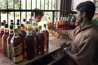 Long queues at liquor shops, authorities struggle to maintain social distancing