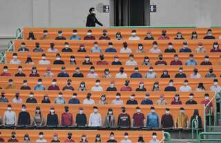 No spitting, no fans: Baseball restarts South Korea's sports season