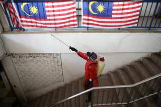 Malaysia decides to not use daily Covid infections as metric to ease curbs