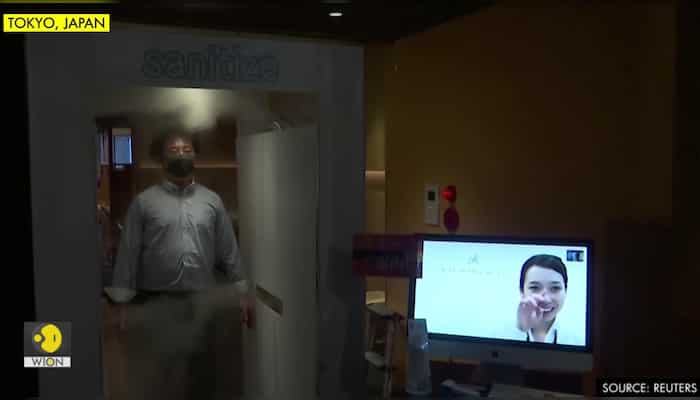 New normal? Japanese pub disinfects customers with spray machine