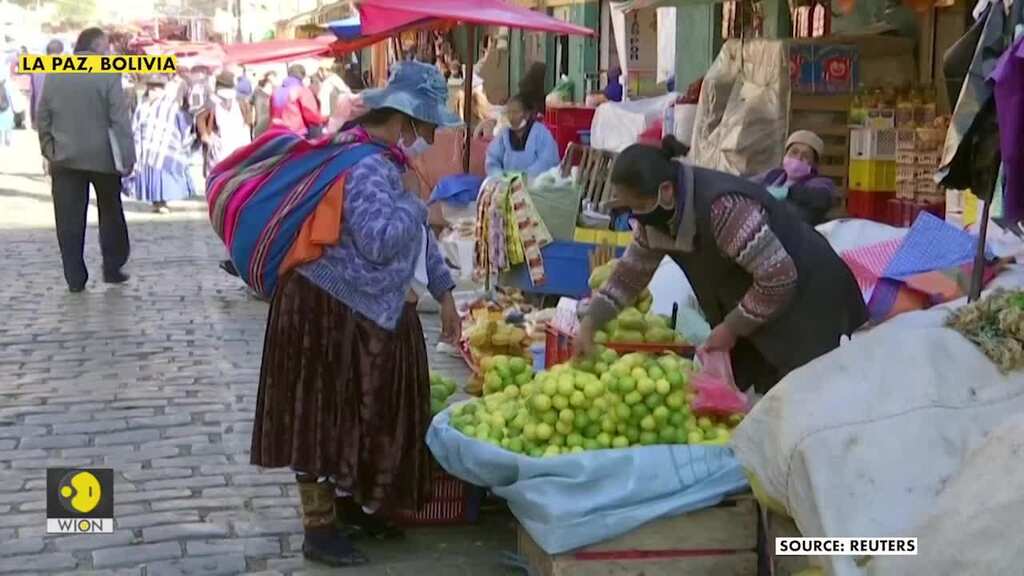 Bolivia's Cholitas don bio-security gear as they go out to sell