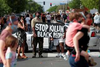 Minneapolis protests: Man killed in Detroit as demonstrations rage across US