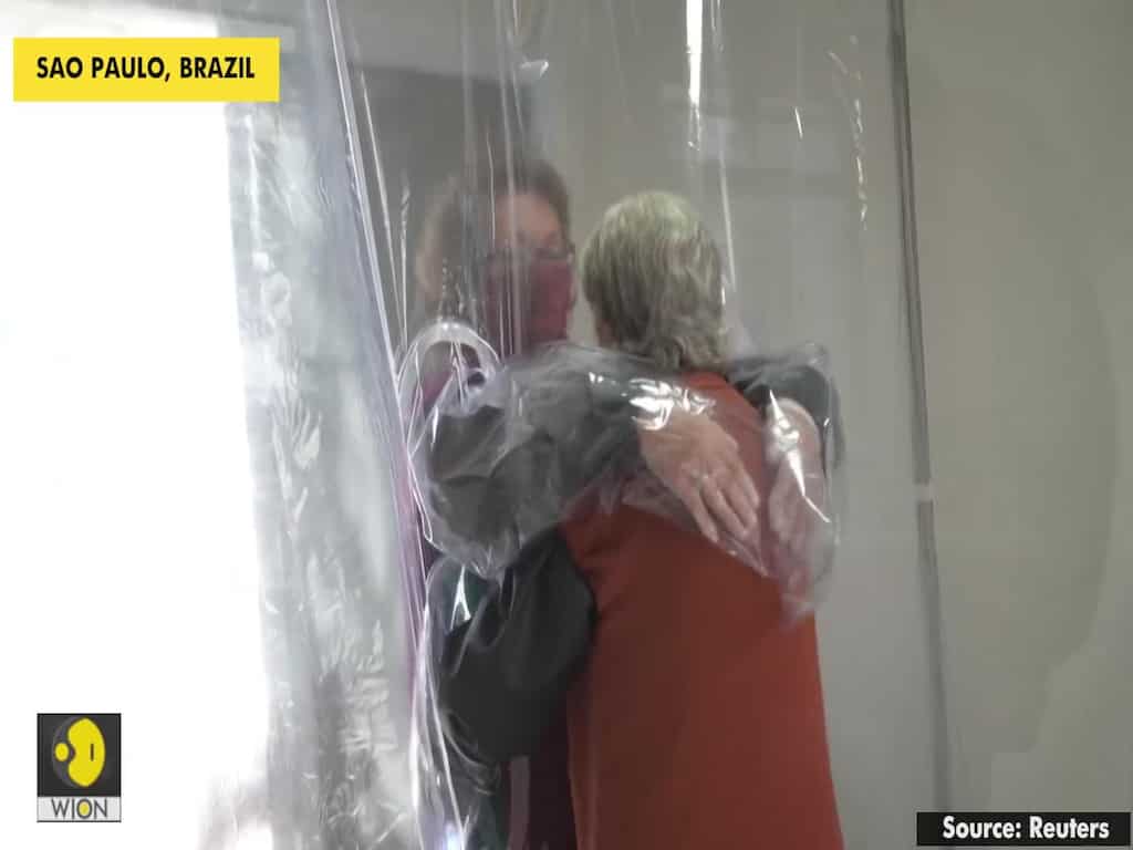 Cuddle curtain reunites separated Brazilians during pandemic