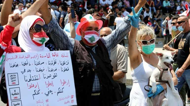 Masks and gloves clad Lebanese join anti-government protests