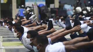 Bangladesh police officers turn to yoga in times of coronavirus pandemic