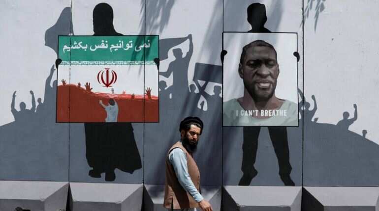Afghan artists paint mural on blast wall in tribute to George Floyd