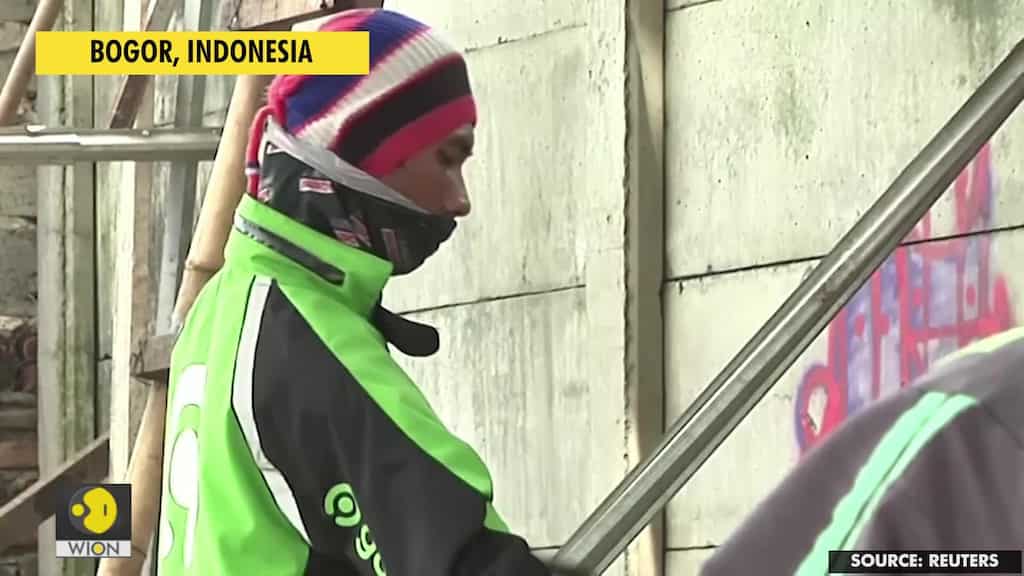 Indonesian motorcycle drivers struggle to survive