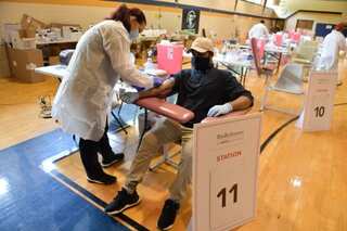 Several US states report spike in coronavirus cases as stocks plunge