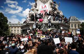 French protesters clash with police at anti-racism protests in Paris