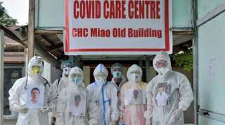 Smiling through PPE kits: Doctors put up smiling photos on PPE suits to destress patients