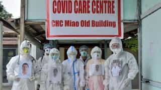 Smiling through PPE kits: Doctors put up smiling photos on PPE suits to destress patients