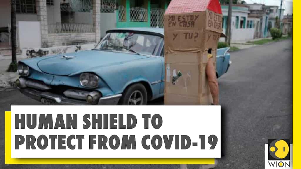 Cubans dons full-body cardboard shield | COVID-19 Pandemic