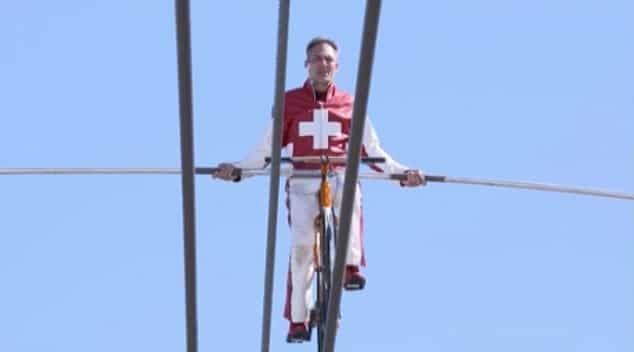 Swiss acrobat walks blindfolded on a rope at an high altitude; Goosebumps guaranteed