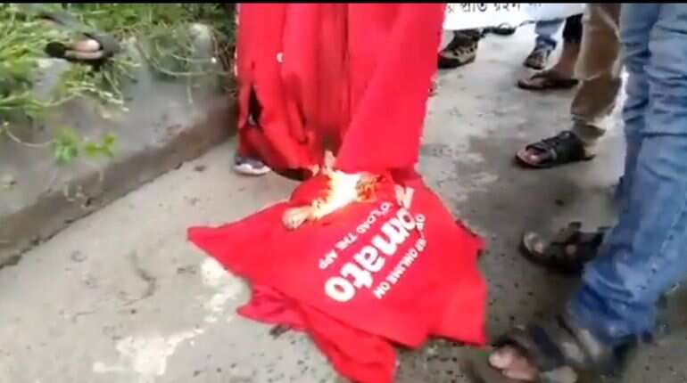 Zomato employees burn official t-shirts over Chinese investment in food start-up Zomato employees burn official t-shirts over Chinese investment in food start-up