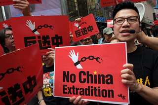 Hong Kong police arrest nearly 200 in first protest under new security law
