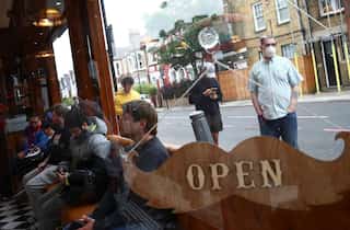 England takes its first steps towards normal life; pubs and hairdressers reopen