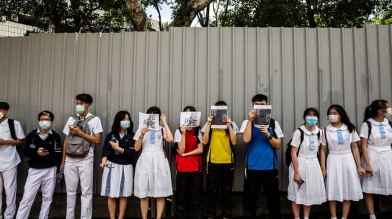 Schools in Hong Kong will review teaching material to 'positively teach' students