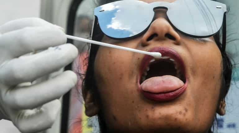 India COVID-19 tally crosses 8 lakh with highest single day spike of 27,114 cases