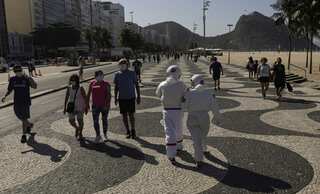 Brazil couple dons astronaut suits to fight coronavirus in style