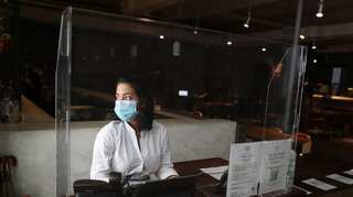 In second year of pandemic, world more stressed and sadder, poll finds