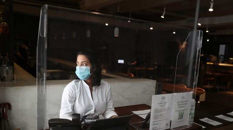 In second year of pandemic, world more stressed and sadder, poll finds