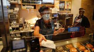 Face coverings made mandatory in shops across England as risks of a second-wave intensify