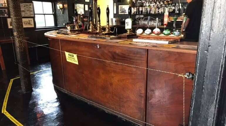 British pub installs electric fence to keep people at bay