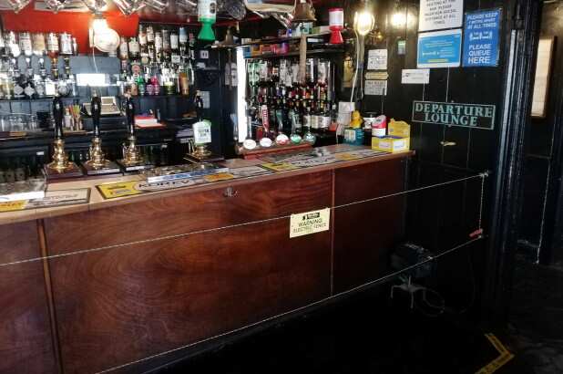 UK Pub installs electric fence to maintain social distancing