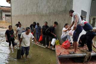 China's Wuhan declares red alert as floods disrupt supply chains