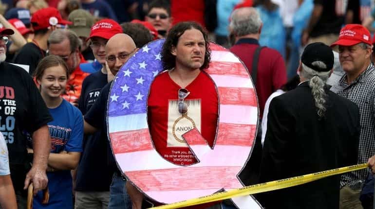 YouTube toughens rules for QAnon conspiracy content